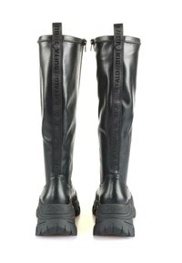 Black knee-high boots made of smooth synthetic material, featuring a chunky sole, embossed branding, and a zipper on the back.