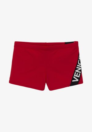Rote Badehosen aus elastischem Material mit flachem Bund. Mit einem schwarzen Seitenpanel mit weißem „VENICE“-Text bedruckt.