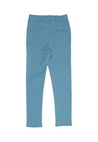 Hellblaue Leggings aus elastischem Stoff, mit einem weichen Bund und zwei Gesäßtaschen mit geschwungenen Nähten.