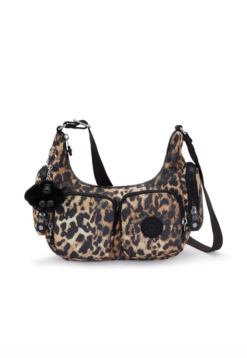 Leopard-print fabric shoulder bag with two front zip pockets, black accents, adjustable strap, and a small furry charm attached.