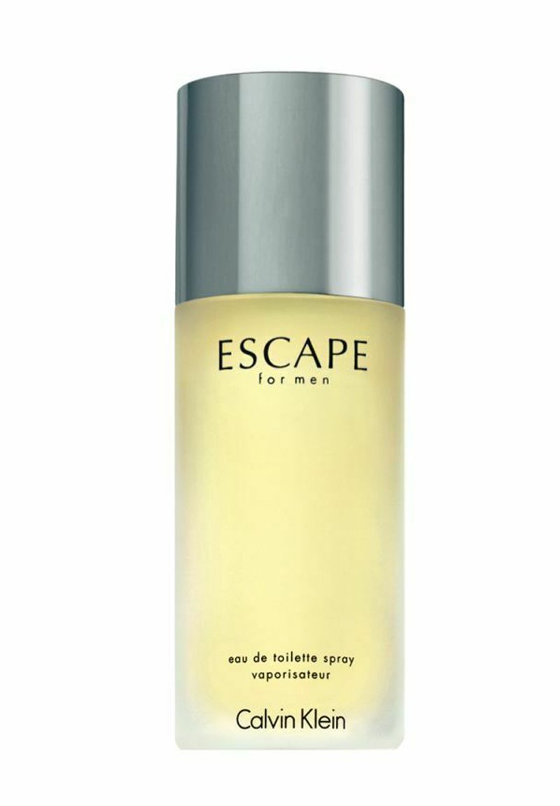 Transparent glasflaska med ett silverlock och en gul insida. Texten lyder "ESCAPE for men eau de toilette spray" med "Calvin Klein"-logotyp.