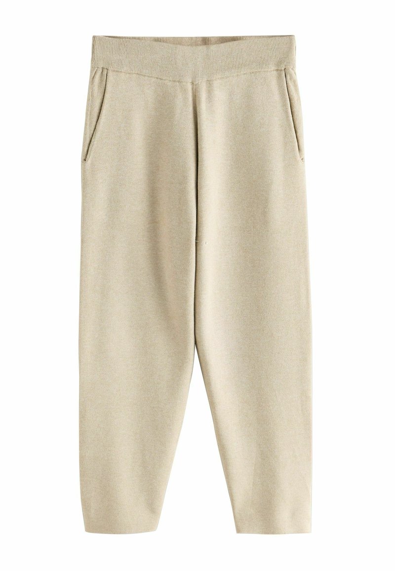 Helle beige Sweatpants mit elastischem Bund, zwei Seitentaschen und lockerer Passform, aus einem weichen, strukturierten Stoff.