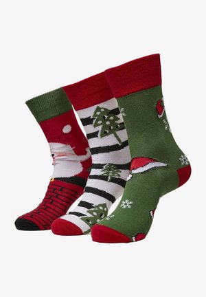 Tre paia di calzini festivi: rossi con design di Babbo Natale, a righe bianche e nere con alberi, e verdi con cappelli di Babbo Natale e fiocchi di neve.
