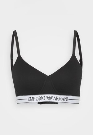 Soutien-gorge sans fil noir en tissu doux, avec décolleté plongeant et bretelles ajustables. Logo Emporio Armani notable sur la bande blanche.