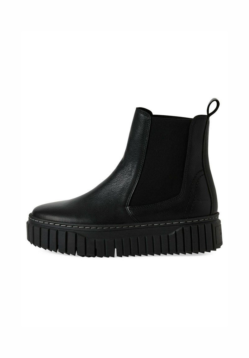 Botas Chelsea de cuero negro con paneles laterales elásticos, suela de goma gruesa y detalles acanalados. Asa en la parte trasera para ponérselas con facilidad.