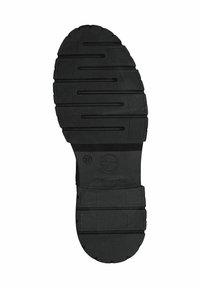 Semelle de chaussure en caoutchouc noir avec un design de semelle à motif comprenant des rainures et un logo en relief. Taille 37 indiquée sur la surface.
