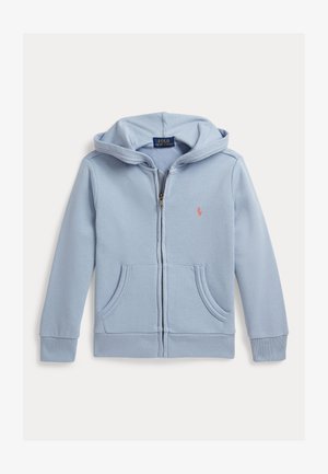 Heleroheline lukuga pusa ees taskute, kapuutsi ja vasakul rinnal väikese roosa tikitud logoga.