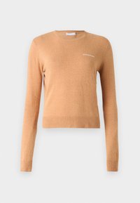 Long-sleeve sweater in light brown, featuring a ribbed hem and cuffs, with a small white logo on the chest. Soft, smooth texture.