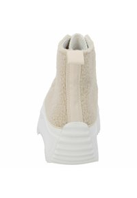 Beige textile-Ankleboot mit strukturierter Oberfläche, elastischer Seitenpartie und einer weißen Gummisohle mit geriffelten Akzenten. Hinterer Zugtab, um das Anziehen zu erleichtern.