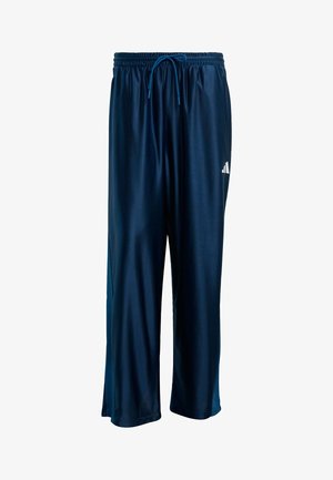 Marineblaue Sporthose aus glattem, leichtem Stoff, mit elastischem Bund und Kordelzug sowie einem weißen Logo an der Seite.