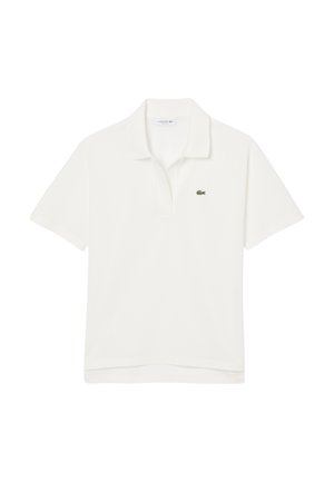 Vit pikétröja i bomull, med en tvåknäppt knäppning, korta ärmar och en grön Lacoste-logotyp på vänster bröst.