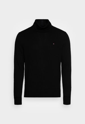 Schwarzer Rollkragenpullover mit langen Ärmeln, aus weichem Strickmaterial gefertigt. Verfügt über ein kleines, gesticktes Logo auf der Brust.