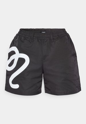 Black athletic shorts made of lightweight fabric, featuring an elastic waistband and a large white graphic design on the left leg.