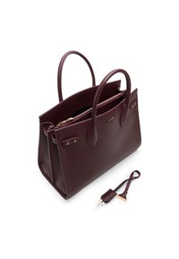 Bordeaux pebret læder tote taske med to top håndtag, en lynlåslomme og hardware i guldfarve. Inkluderer en aftagelig rem med en accent.
