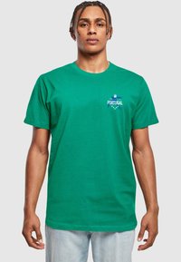 Green cotton t-shirt with short sleeves, rounded neckline, featuring a blue "PORTUGAL" graphic on the left chest area.