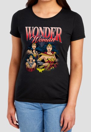 Black T-shirt featuring three illustrated Wonder Woman poses and the text "Wonder Woman" in red and white above the images.