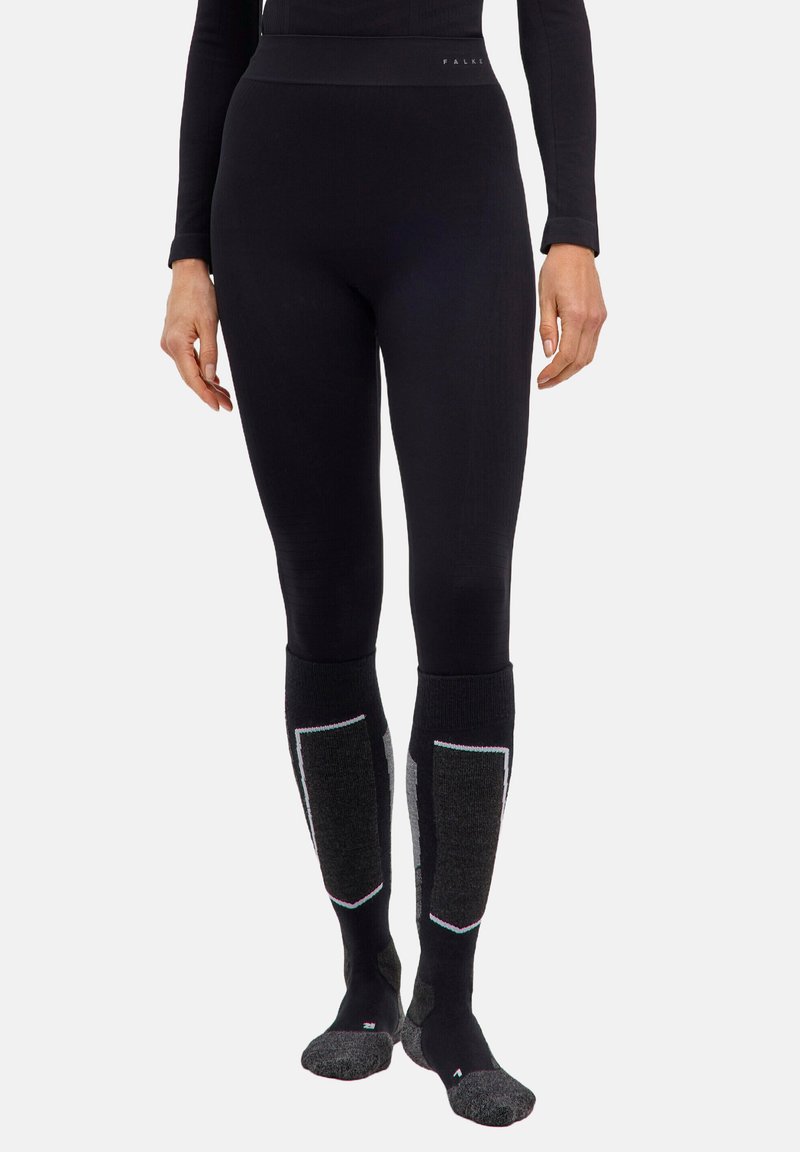 Schwarze thermische Leggings mit hohem Bund, geripptem Muster und kontrastierenden grauen Knieflicken; entworfen für Wärme und Komfort.