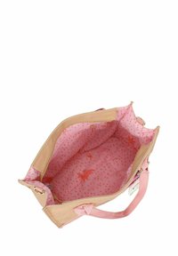 Beige en roze handtas met een gestructureerde buitenkant. De gevoerde binnenkant heeft een roze patroon met oranje accenten en een ritsvak aan de binnenkant.