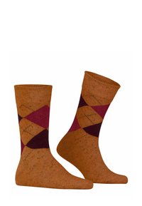 Pomarańczowe skarpetki z wzorem w diamenty, ozdobione akcentami w kolorze bordowym i burgundowym. Żebrowany wzór z miękką teksturą i wzmocnionymi palcami.