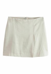 Mini gonna beige chiaro con una texture liscia, presenta una chiusura con zip laterale e una piega frontale per un ulteriore dettaglio di design.