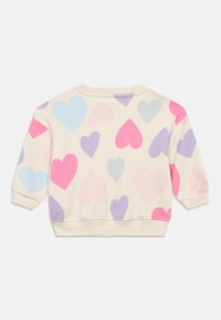 Ανοιχτό μπεζ φούτερ με πολύχρωμα σχέδια καρδιών σε ροζ, μοβ και μπλε. Μαλακό ύφασμα με ριμπ μανσέτες και τελείωμα.