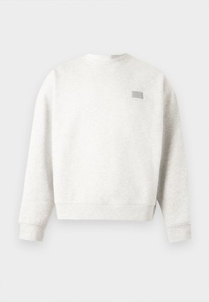 Light gray crewneck sweatshirt with long sleeves and a small rectangular patch on the upper left chest.