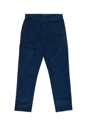 Pantalones de pana azul marino con cinturilla elástica, cordón, dos bolsillos laterales y tobillos ajustados. Tejido texturizado con estrías verticales.