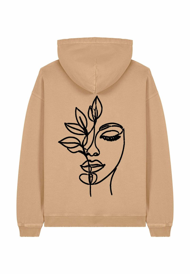 Felpa beige con un design a contorno di un volto e foglie nere sul retro. Tessuto morbido con una vestibilità comoda e cappuccio con cordini.