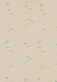 Light beige fabric featuring a scattered pattern of small teal birds. The texture is smooth, with a subtle heathered appearance.