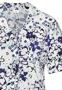 Short-sleeve shirt with a floral pattern in purple, navy, and light teal on a white background; features a notch collar and buttons.