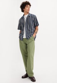 Levi's® - Chinosy