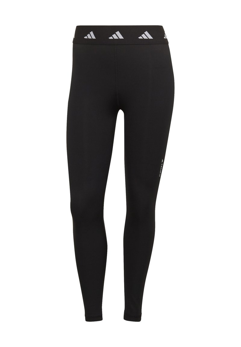 Czarne legginsy wykonane z elastycznego materiału z wysokim stanem, ozdobione trzema białymi logo adidas. Minimalistyczny design, gładka tekstura.