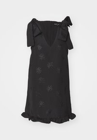 Black sleeveless dress featuring a V-neck, bow accents on shoulders, embossed floral pattern, and ruffled hem. Textured fabric adds depth.