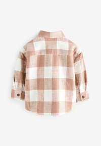 Next Pluus - rust brown