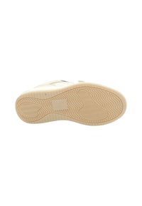 Suola di scarpa bianca con una superficie in gomma testurizzata. Presenta un motivo a zigzag per la presa e due distinti disegni ovali nel battistrada.