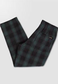 Pantalon à carreaux noirs et verts avec taille élastique et une poche arrière ornée d'une étiquette logo. Tissu doux et coupe décontractée.