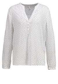 Valkoinen pitkähihais blouse, jossa on V-pääntie, napitus ja pieniä harmaita sydänkuvioita hajallaan. Kevyt kangas.