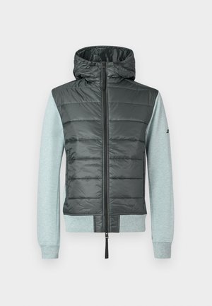 Giacca con cappuccio, dotata di una parte superiore gonfiabile di un grigio scuro e maniche in maglia grigia chiara. Presenta una zip frontale completa e polsini a costine.