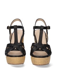 Sandalias de cuña negras con una plataforma de yute trenzado. Incluye un diseño de tiras entrecruzadas y una correa de tobillo ajustable. Parte superior de cuero suave.