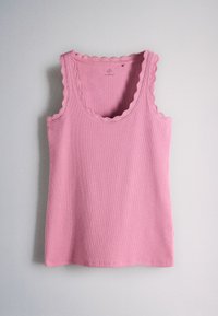 Pink knitted sleeveless tank top with scalloped edges on neckline and armholes, displayed against a plain light background.