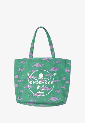 Green tote bag with pink spotted kangaroo pattern and white "Chiemsee" logo featuring an outstretched human figure inside a circle.