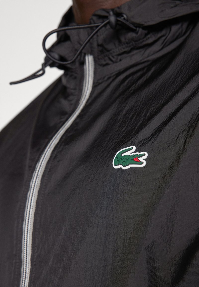 Lacoste Sport PARKAS BLOUSONS Cortaviento black/negro