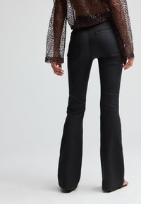 Next COATED - Jeans Bootcut - black