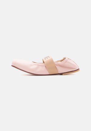 Light pink ballet flat with elastic strap, square toe, flat sole, and soft material, shown from side on white background.