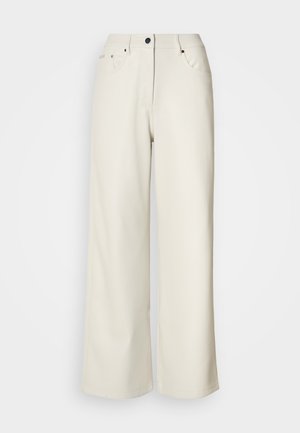 Krémpové kalhoty s širokými nohavicemi vyrobené z hladkého materiálu. Mají střední pas, zipový klíč a dvě přední kapsy s černými kovovými doplňky.