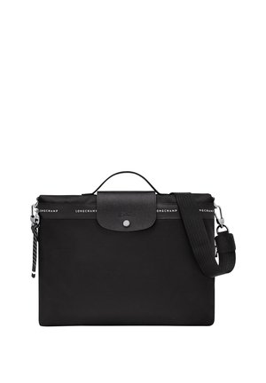 Black nylon bag with a textured leather flap, silver snap closure, and a detachable striped shoulder strap. Features logo detailing.