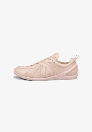 Light pink athletic shoe with a textured leather upper, mesh accents, rounded toe, and a molded rubber sole with a grip pattern.