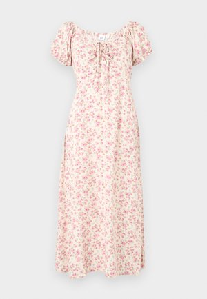 Κρεμ μεσοφόρεμα με ροζ φλοράλ σχέδιο, φουσκωτά μανίκια, τετράγωνη λαιμόκοψη και λεπτομέρεια δέσιμου μπροστά.