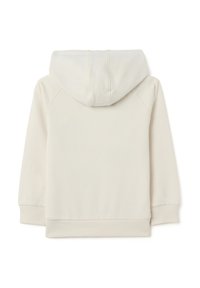 Haut à capuche beige clair avec une texture douce, comportant un cordon de serrage à la capuche, des poignets et un ourlet côtelés. Le design inclut des manches raglan pour une plus grande liberté de mouvement.