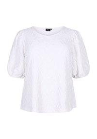 Haut blanc à manches bouffantes en tissu texturé avec un motif ondulé. Encolure arrondie et coupe décontractée. Pas de matériel ou d'accents visibles.